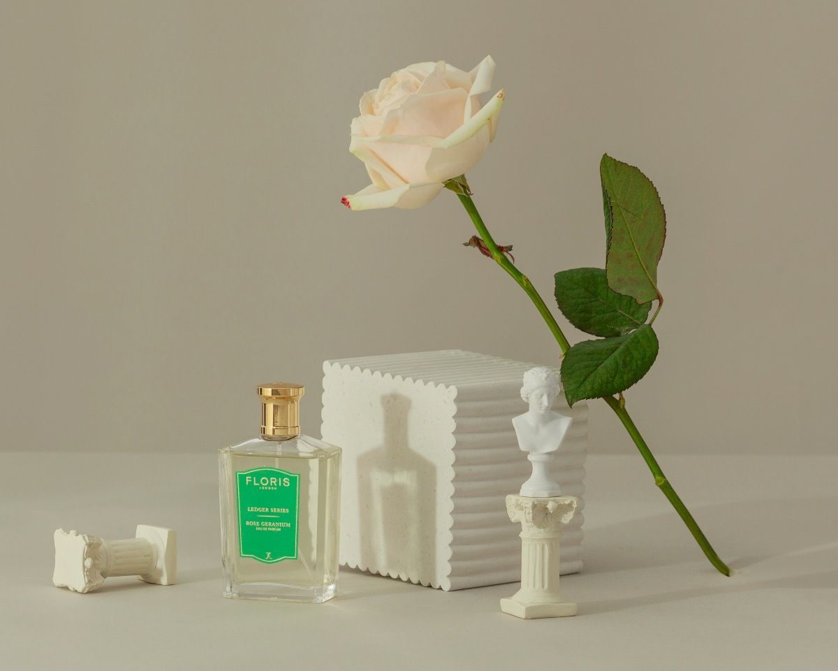 Rose Geranium from Floris shown with a flower against a beige background